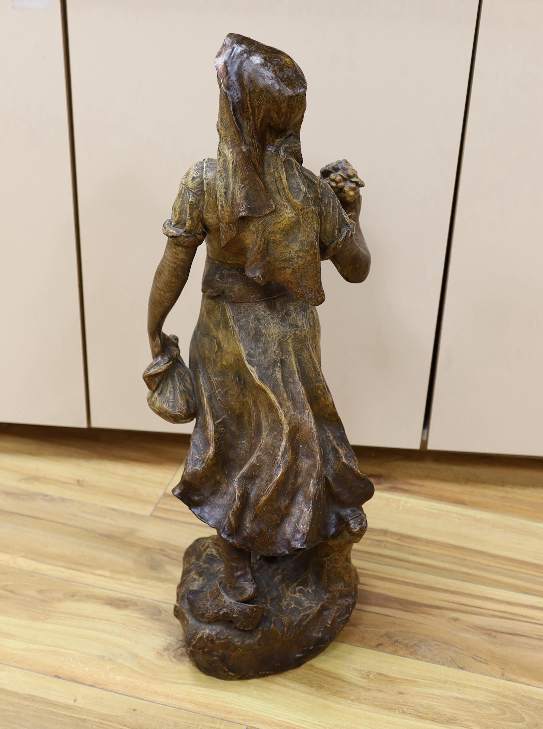 A Van Hasselt earthenware figure, signed by artist to base, 73cm